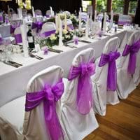Chiavari chairs with Radiant Orchid chair sashes