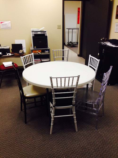 6 Resin Chiavari Chairs around 48 inch Table