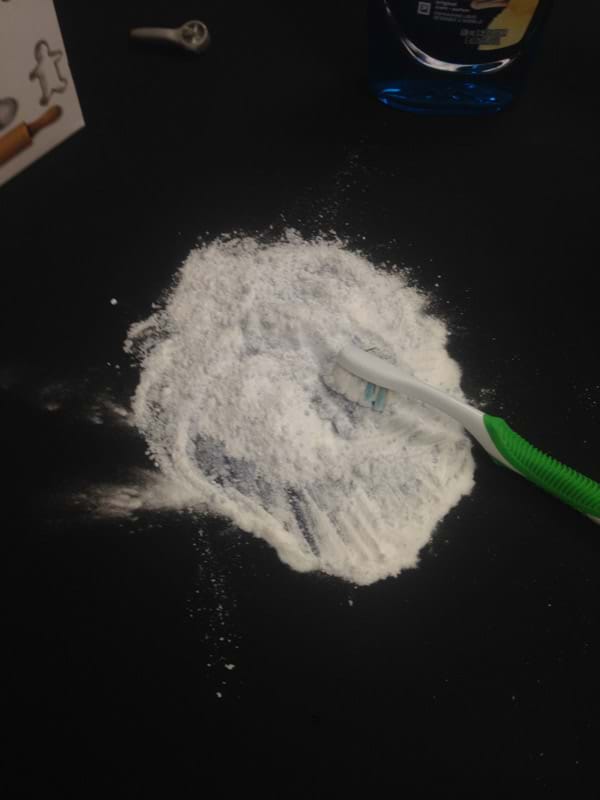Clumping Baking Soda from Oil Stain