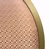 Close up of pattern - peach pattern upholstery with gold speckled frame